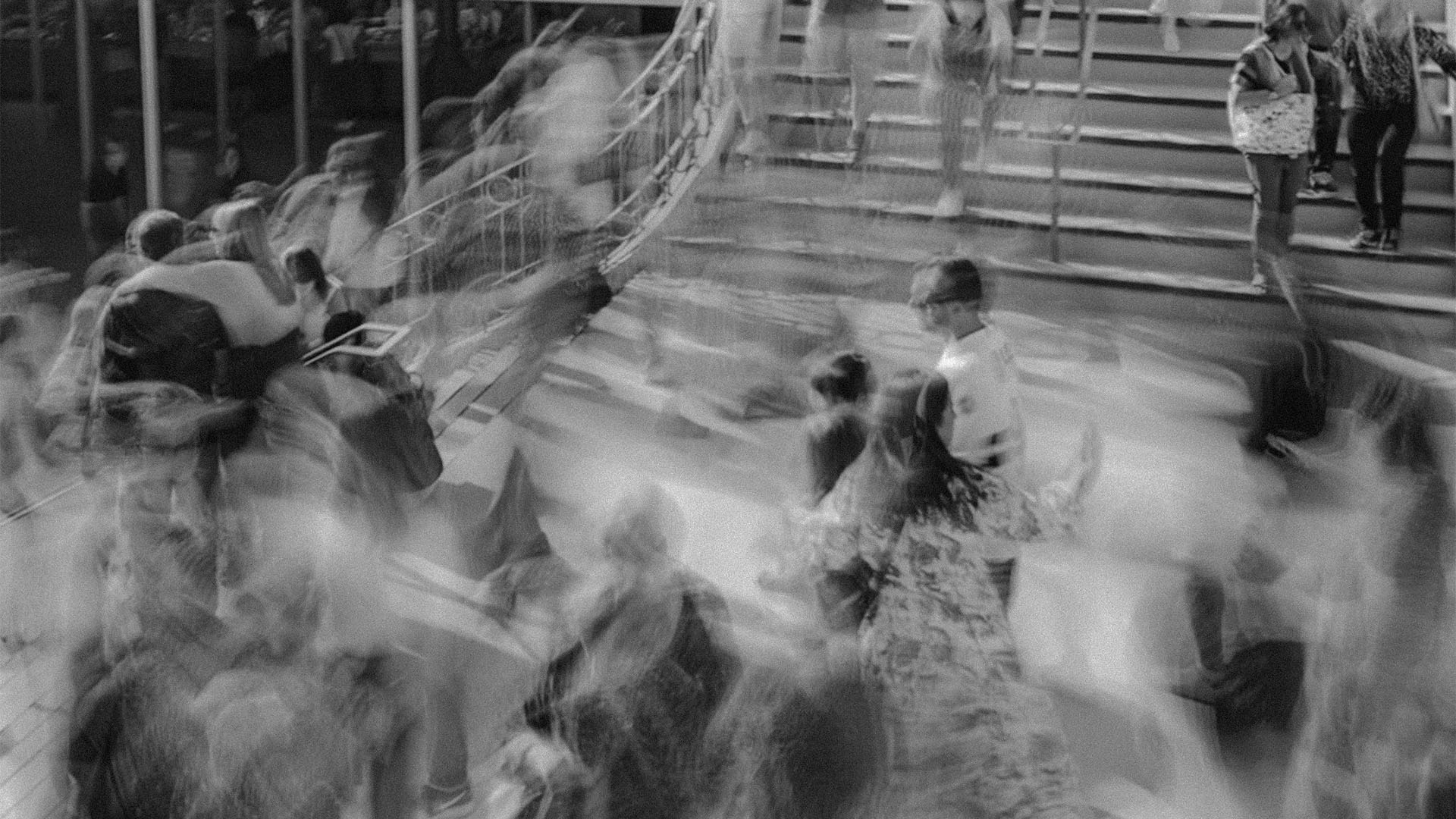 Blurred crowd moving through a large staircase