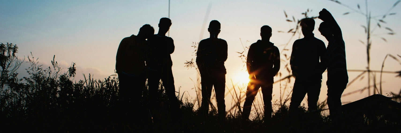 silhouettes of people socialising