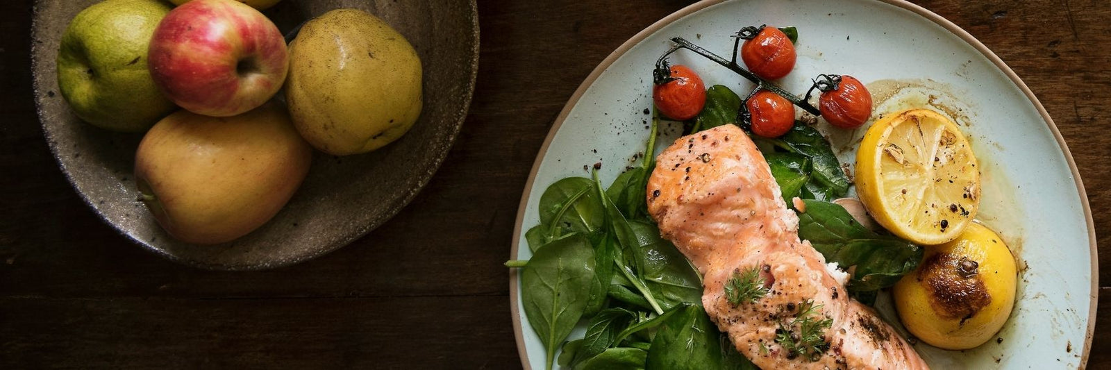 salmon dish and apples served on plates