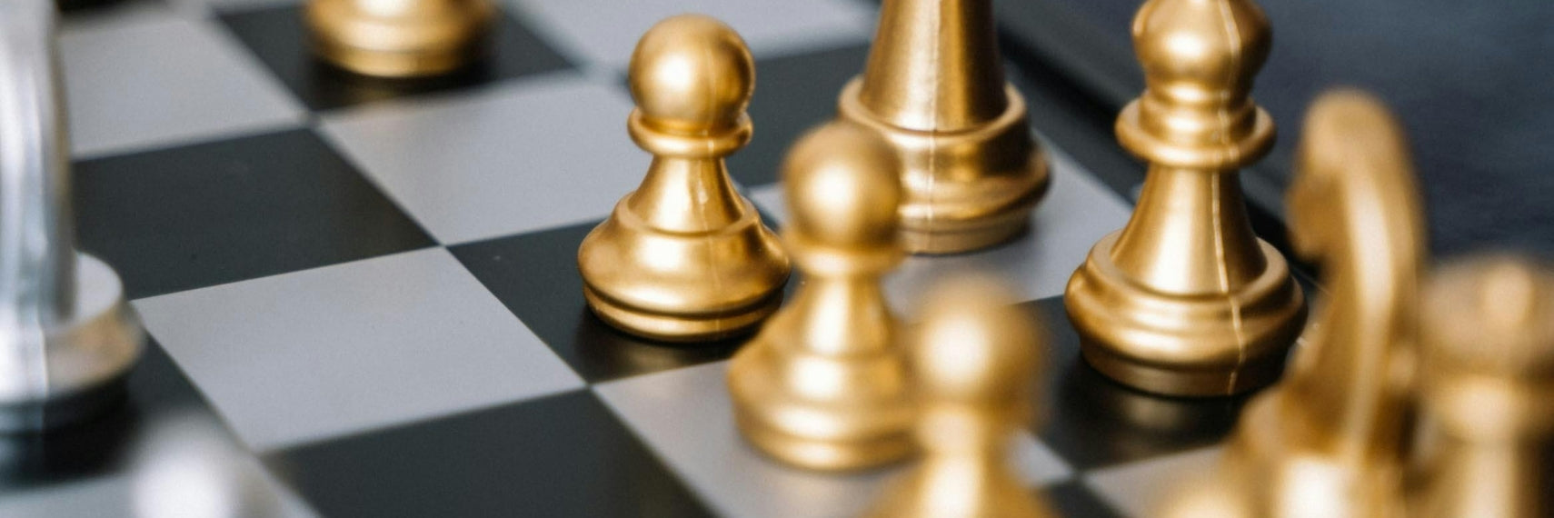 golden chess figures on the chess board