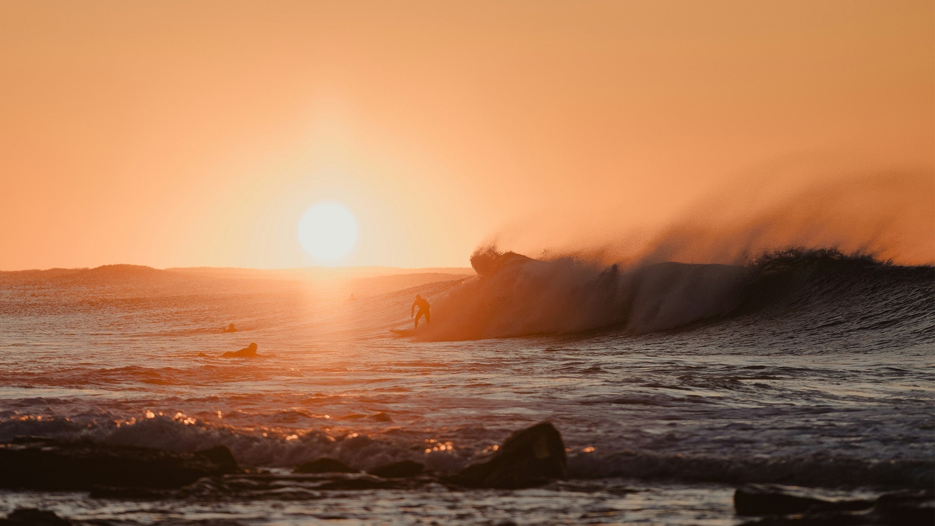 Sunrise above the ocean waves