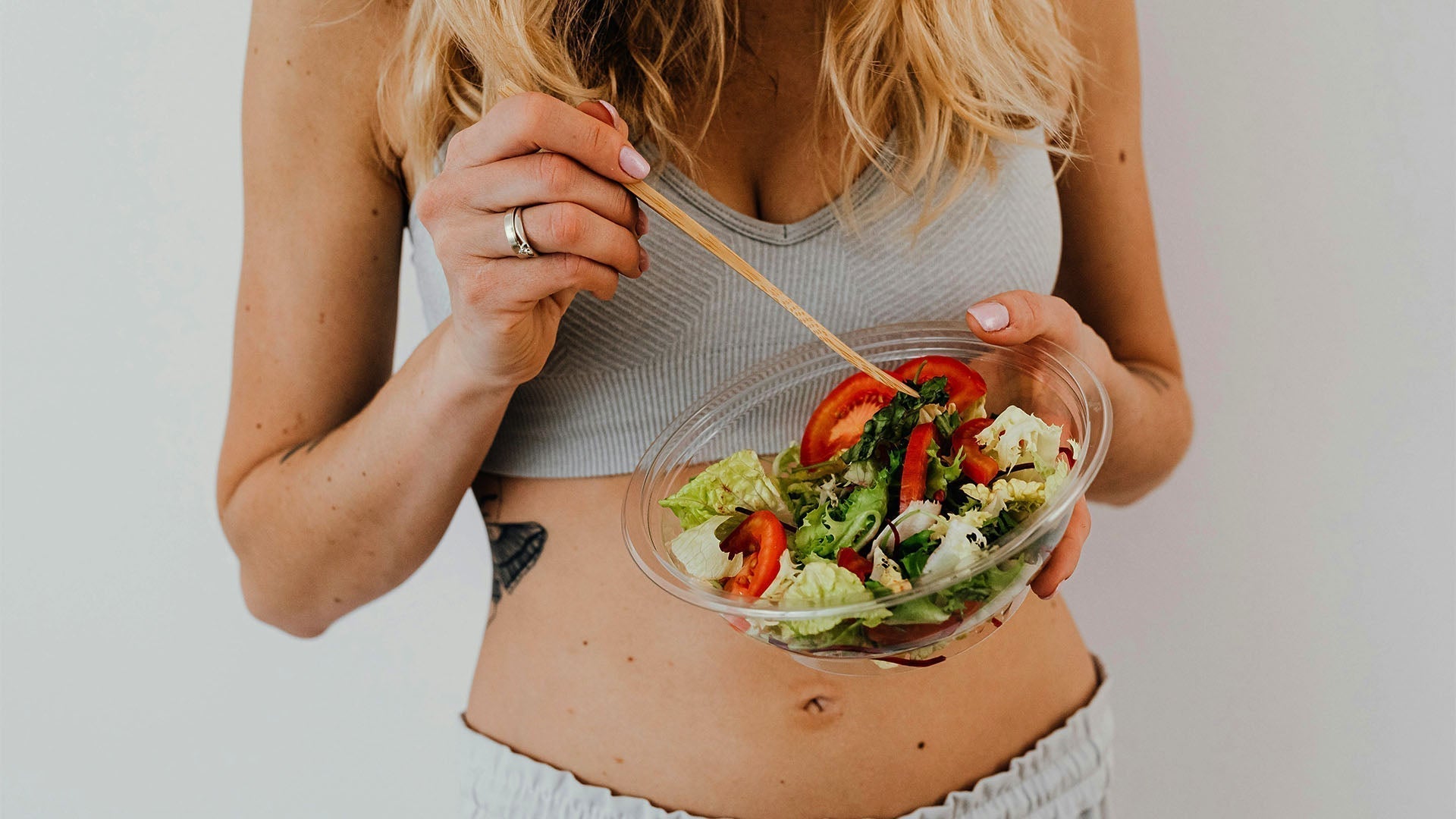 Woman eating salad