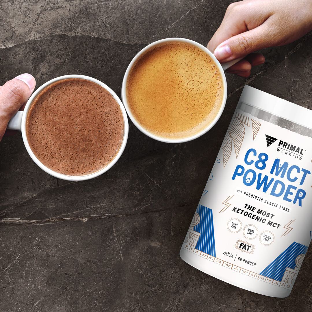 Image of a hot cup of coffee and a cup of hot chocolate, both made with Primal Warrior C8 MCT Creamer